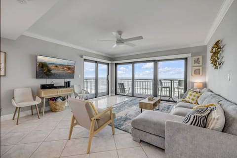 Kick back on the cozy sectional sofa and soak in the oceanfront views at Shorehom by the Sea 65.