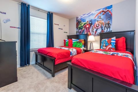 Hero-themed twin room with bold colors, fun decor, and perfect for young adventurers.
