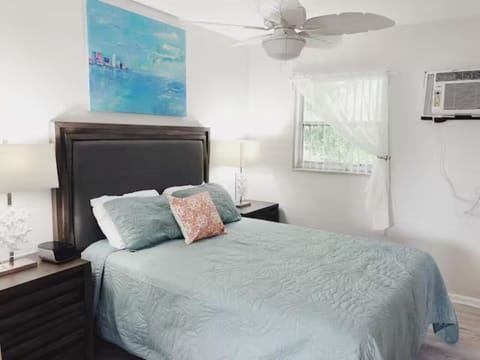 Embrace serenity in our bedroom sanctuary. The bed beckons, flanked by stylish side tables. Adorned with captivating wall paintings and framed by a window, it's a harmonious retreat for tranquil nights and dreamy mornings.