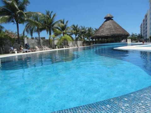 Shared condominium pool with palapa