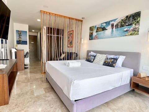 Bedroom area with king bed and sea view
