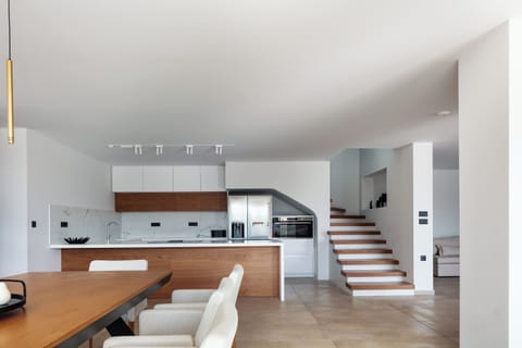 The kitchen is fully equipped with state-of-the-art appliances, ensuring that preparing meals feels like a delightful breeze