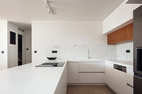 The kitchen is fully equipped with state-of-the-art appliances, ensuring that preparing meals feels like a delightful breeze