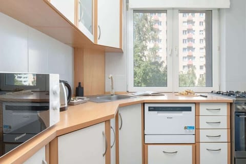 The kitchen offers a functional layout for convenient cooking.