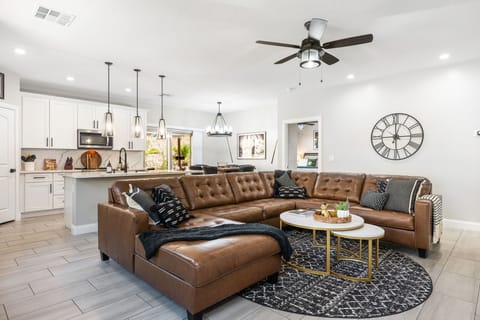 Living area w/ 75" LG Smart TV with basic cable and streaming capabilities.