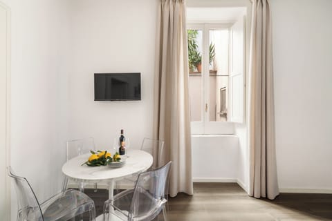 Deluxe Apartment, 2 Bedrooms | Living area | 32-inch LED TV with digital channels