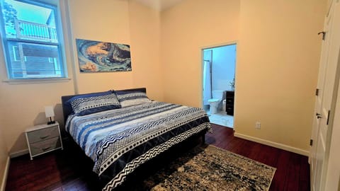 This king-sized bedroom offers the perfect retreat for relaxation and comfort.
