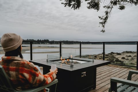 Shared ocean side pergolas with gas fire pits