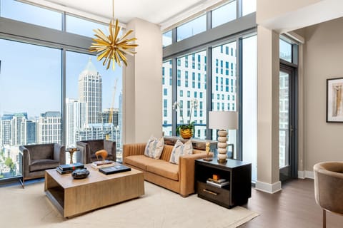 Living room featuring a 65" 4K UHD TV