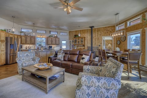 The main family space is located on the upper level of this hillside home. Abundant windows let the light and views flow in all year round!