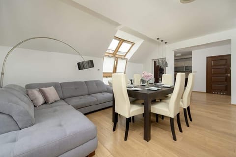 Enjoy your favorite shows on the flat-screen television in the elegant living area.