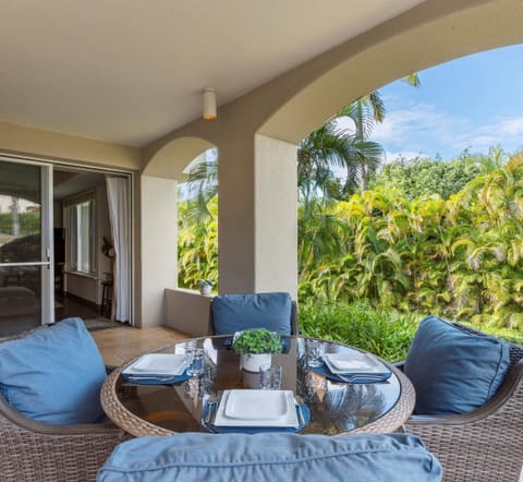 Dine al fresco on your private terrace, where tropical palm views and comfortable seating create the perfect backdrop for memorable meals.