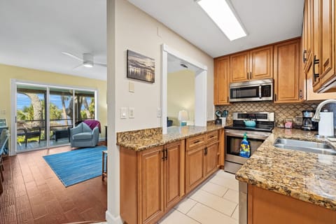 Galley style kitchen next to the living room