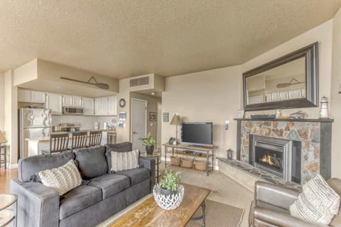 A modern, open-concept living space with large windows, cozy seating, a spacious dining area, and a bright, inviting atmosphere.
