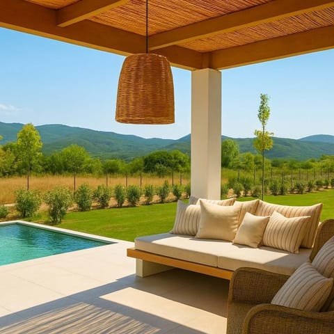 Shaded poolside lounge with countryside view
A quiet and stylish corner to relax under the pergola beside the pool, surrounded by nature.