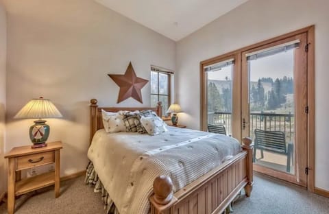 Retreat to a serene bedroom with calming decor and direct access to a private balcony, ideal for enjoying fresh air.