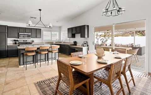 Enjoy effortless entertaining with a dining area and kitchen seamlessly connected, creating a perfect flow for meals and socializing