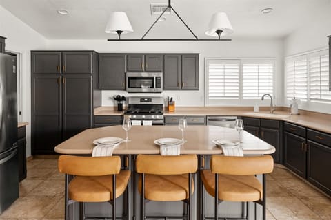 Gather around our center island with three stylish bar stools, ideal for casual meals and lively chats.