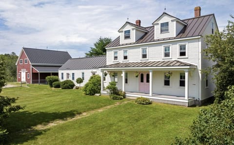 Meadow View has a beautiful covered porch and spacious lawn for guest use