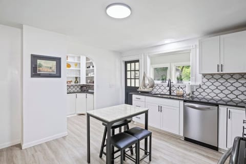Sleek kitchen with marble-top island and plenty of counter space ✨ Perfect for cooking and entertaining in Canandaigua.