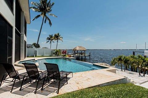 This waterfront property is the epitome of Florida living with a backyard paradise that’ll rival any resort with a swimming pool, loungers, and dock access!