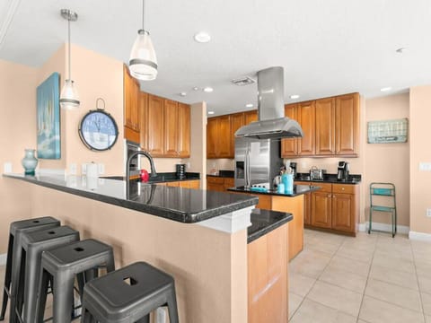 Spacious kitchen w/ generous counters & island, offering plenty of room to prep & serve.