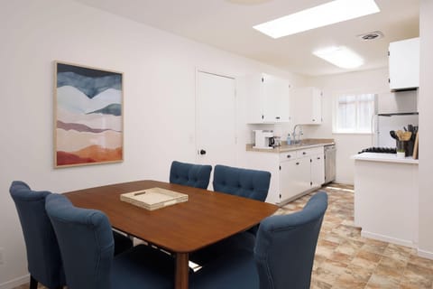 Cozy dining area with 5-seater table next to the kitchen
