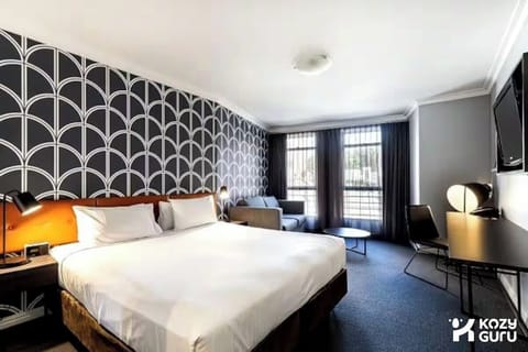Cozy bed prepared for a restful night’s stay.