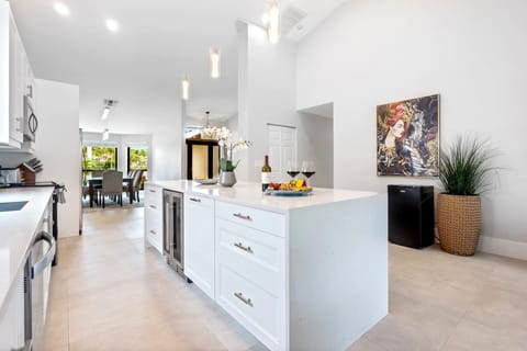 Open concept design connecting the living room, kitchen, and dining area.
