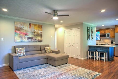 The lower-level living room boasts a sleeper sofa and convenient access to the fully equipped kitchen.