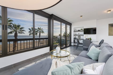 Luxury Apartment, Sea View | Living area | 50-inch TV with cable channels