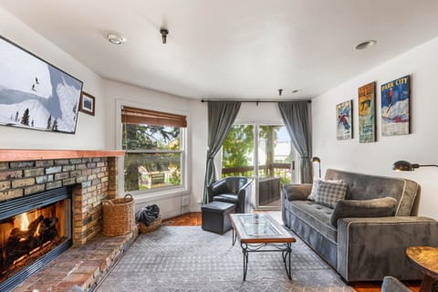 Vacation Rentals in Park City at Ski Team 1: Living room - wood-burning fireplace, sofa and TV