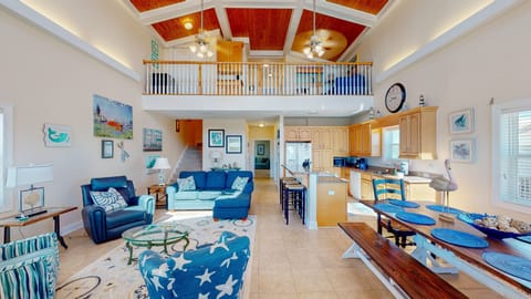 The lofty main floor living space seamlessly integrates the living, dining, and kitchen areas into a social hub, encouraging and promoting quality time with loved ones.