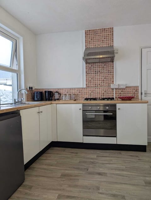 The kitchen is just inside the front door entrance from the courtyard.