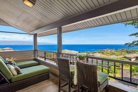 Oceanfront lanai with dining for six, showcasing panoramic Kapalua views, tropical breezes, and seamless indoor‑outdoor living.