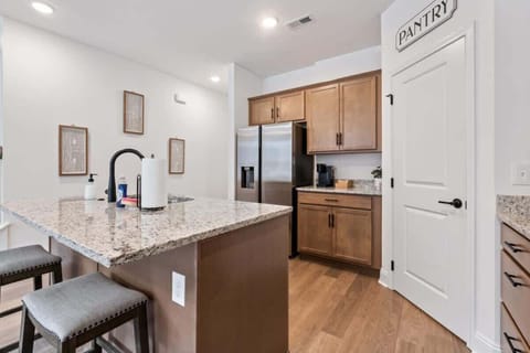Our kitchen is fully furnished with stainless steel appliances, cookware, plates, utensils, and everything you need to prepare delicious meals. Additionally, the kitchen includes bar seating for two.