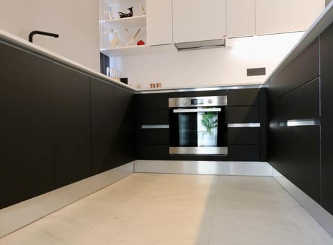 Kitchen black white oven design Holiday Via de Filippi 14A Olbia Rental 12 com