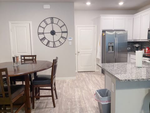 dining table, garage door and kitchen