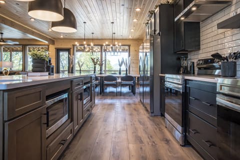 Step into a chef’s paradise! This fully equipped modern kitchen features high-end appliances, ample counter space, and stunning views—perfect for cooking and gathering with loved ones.