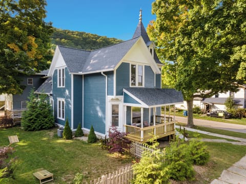 OVERVIEW:  The front and east isde of the of the house (including fenced-in backyard) in summer.