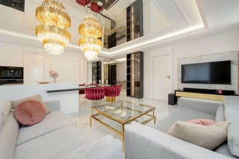 Bright living room with marble flooring, an elegant sofa and a gold coffee table A bright living room with marble flooring, an elegant sofa and a gold coffee table creates a luxurious space for relaxation. luxurious space for relaxation. luxurious sp