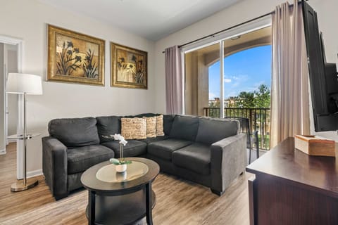 - Beautiful living room with a plush corner sofa ideal for relaxing & entertainment - Living room features access to the balcony making it easy to enjoy outdoor view - Decorated with tasteful artwork and a chic coffee table creates a warm space