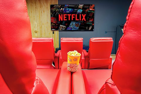 Enjoy a movie on the impressive 98-inch TV for the ultimate viewing experience.