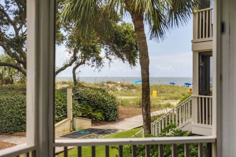 Beach and ocean views from your screened-in porch, with steps leading to private beach access or the pool.