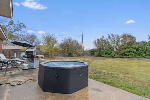 Jacuzzi, Natural gas grill, fire pit, table, chairs and umbrella