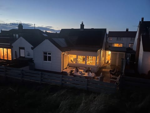 Marram Cottage secure rear garden & patio with direct access to dunes and beach