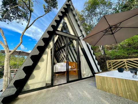 Deluxe Cabin, Balcony, Garden View | Living area | TV