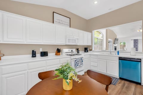 The kitchen is spacious & well-equipped, offering all the comforts of home