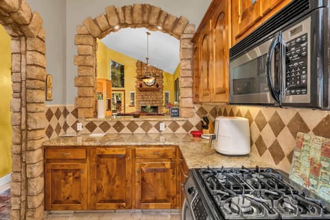 The gorgeous kitchen offers ample space & all the comforts of home