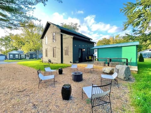 The fire pit area and rear yard. Please note that the grill, outdoor furniture, fire pit, and exterior lodge are not available between mid November through the end of April.